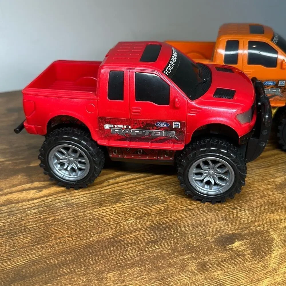 Ford F-150 Raptor Red Orange Plastic Truck‎ set of 2 Made in China